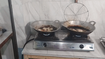 Fried street food stall in action, Sukaraja, Indonesia