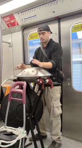 Handpan music fills a Santiago Metro car