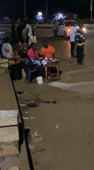 Nighttime street market bustles in Bukuru, Nigeria