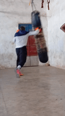 Early morning boxing gym session, heavy bags and jump rope