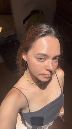 Woman takes mirror selfies in San Bernardino Tlaxcalancingo home