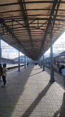 Early morning train boarding observed at urban station platform