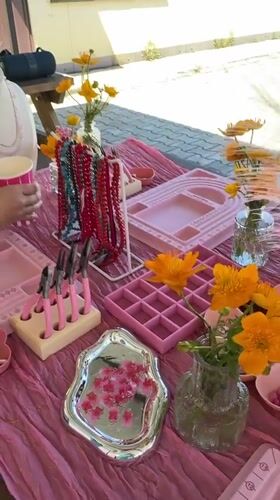 Outdoor jewelry-making workshop in Birobidzhan with crafts and food