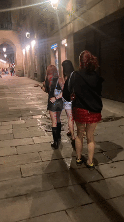 Young adults enjoy late-night Barcelona street scene, club visit