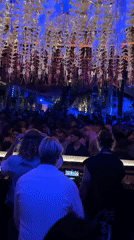 Club gathering with DJ setup captured in North Kuta
