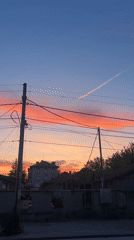 Sunset with airplane contrail observed over Plovdiv, Bulgaria
