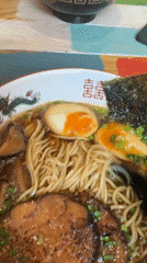 Diner documents Asian meal with ramen, dumplings in Saint Petersburg