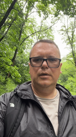 Kyiv park visitor documents wet pathways, wildlife, fallen branches