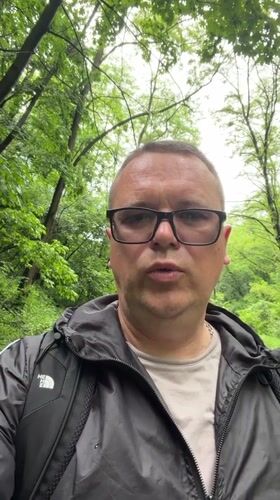 Kyiv park visitor documents wet pathways, wildlife, fallen branches