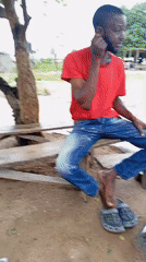 Daily life unfolds in Nigerian community gathering spot