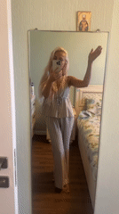 Casual indoor moments in a Moscow room, striped outfit, selfie and camera chat