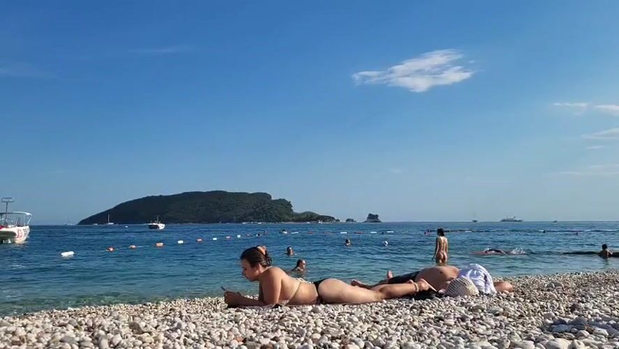 A summer afternoon across Budva's beaches, streets, and cafés.