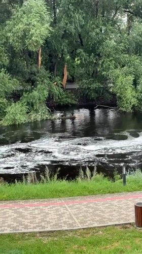 High river and mixed cityscape in Yekaterinburg on a grey morning