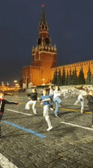 Acrobatic group performs handstands on Red Square at dusk