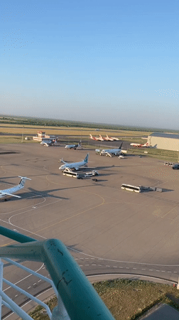 Astana airport tarmac from above, planes parked on a sunny day