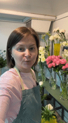 Flower shop staff work with peonies, carnations in Izhevsk
