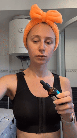 Woman applies skincare products during morning routine in Montenegro