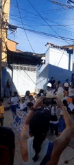 Elementary students stage parade with international flags in Mérida