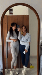 Mirror selfie in a Kuta Selatan hotel room, matching grey fits