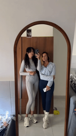 Mirror selfie in a Kuta Selatan hotel room, matching grey fits