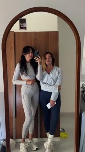 Mirror selfie in a Kuta Selatan hotel room, matching grey fits
