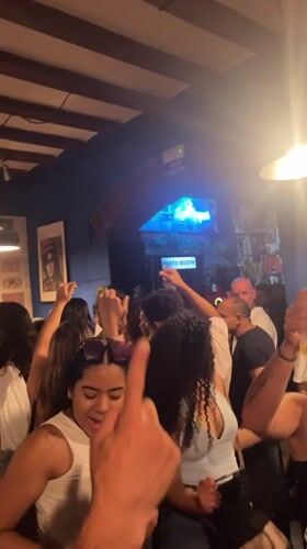 Late-night dancing and socializing at a Barcelona bar