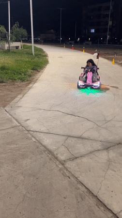 LED go-karts light up a park path in Arica at night
