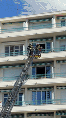 Firefighters conduct ladder rescue operation in Nice apartment building