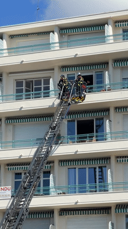 Firefighters conduct ladder rescue operation in Nice apartment building