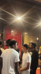 Late night Tampa scene: bar queue and pizza restaurant