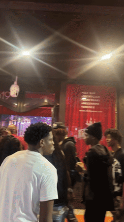 Late night Tampa scene: bar queue and pizza restaurant