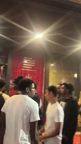 Late night Tampa scene: bar queue and pizza restaurant
