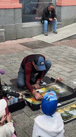 Street artist performs spray paint demo in Plovdiv pedestrian area