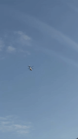 White helicopter spotted flying over New York evening sky