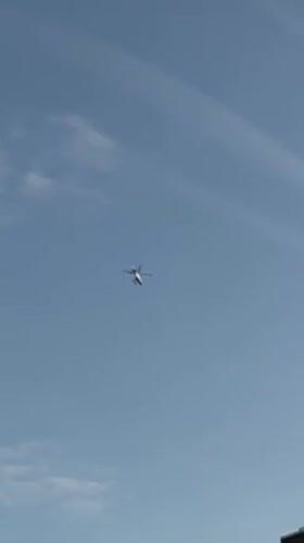 White helicopter spotted flying over New York evening sky