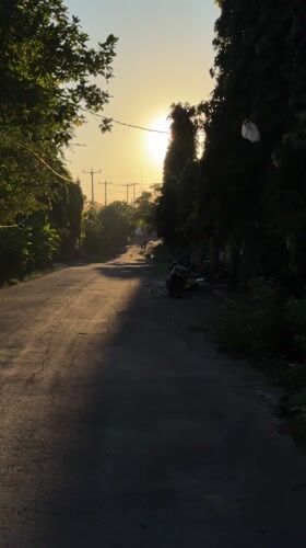 Sunset road scenes documented across Ungasan, Indonesia