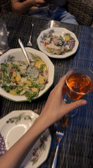 Laid-back evening gathering with food and candid moments in Tomilino