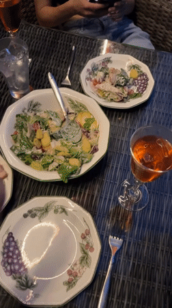 Laid-back evening gathering with food and candid moments in Tomilino