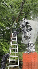 Wet forest, flowing water, and sculpture maintenance in Hakone