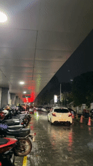 Rainy night scene captured in Madiun with parked motorcycles