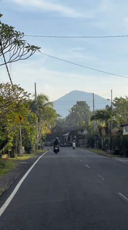 Motorbikes travel tropical road in Selemadeg Barat, Indonesia