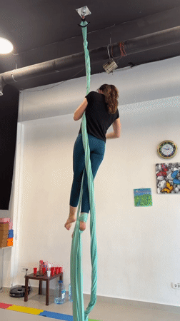 Woman practices aerial silks at Montenegro studio