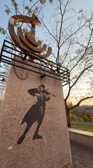 Tourist documents Birobidzhan monuments and architecture during evening walk
