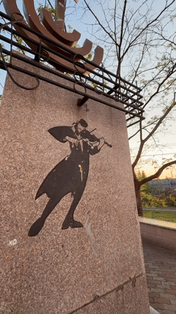 Tourist documents Birobidzhan monuments and architecture during evening walk