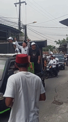 Religious motorcycle procession rolls through Wanajaya streets