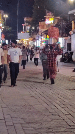 Manali market street buzzing on a summer night