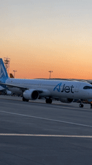 AJet passengers board aircraft at sunset in Pendik, Turkey