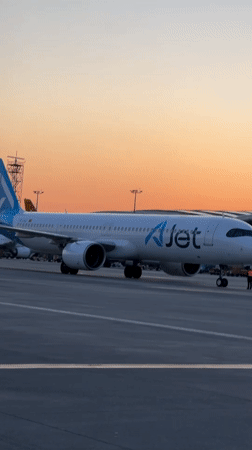 AJet passengers board aircraft at sunset in Pendik, Turkey