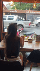 Woman shops health stores, visits cafe in rainy Baan Lamai morning