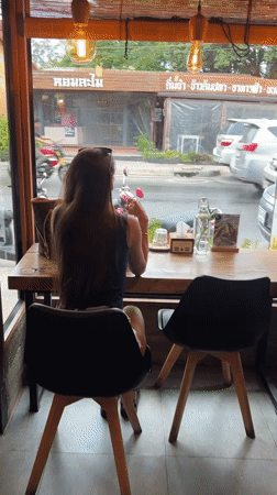 Woman shops health stores, visits cafe in rainy Baan Lamai morning